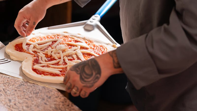 Pizza preparation in restaurant